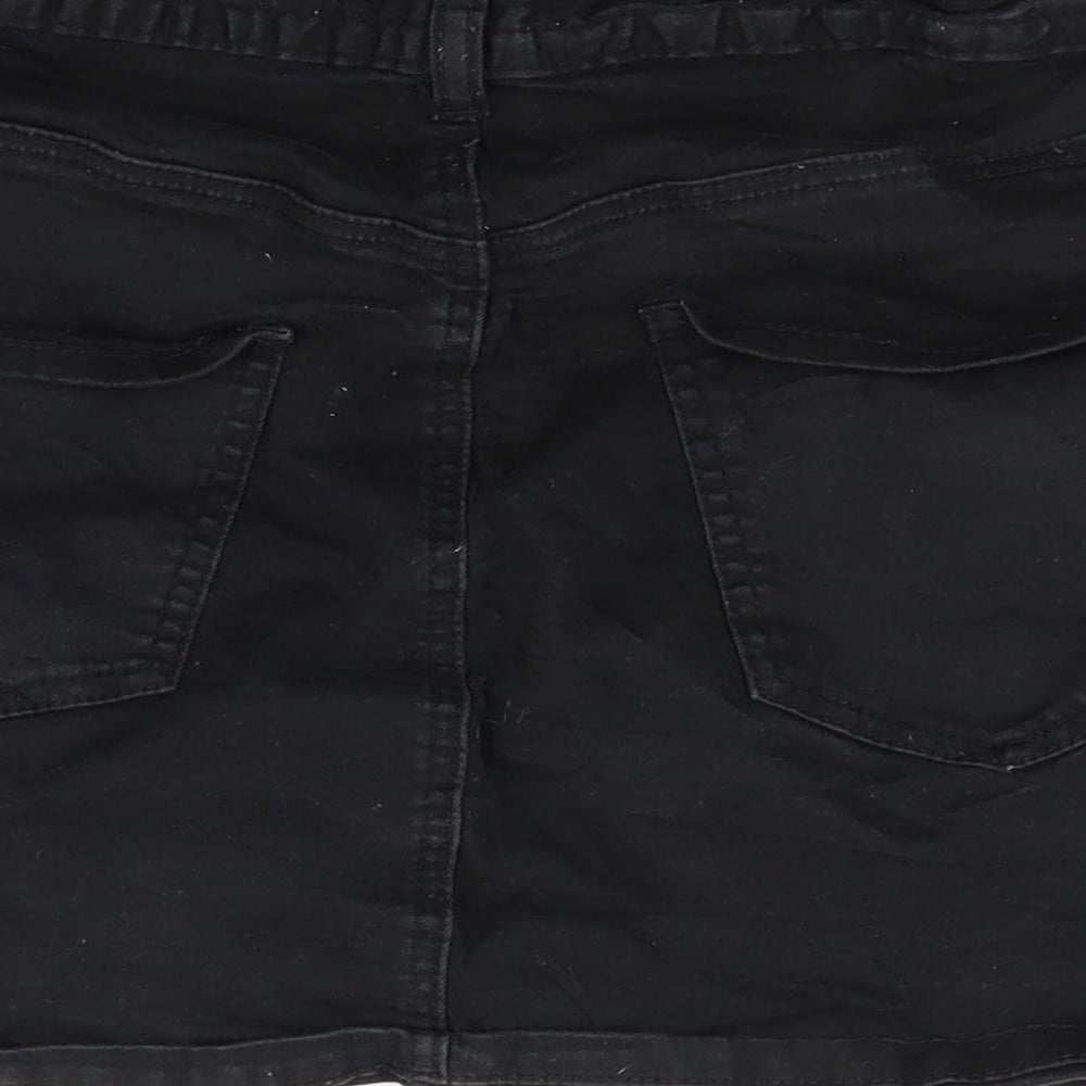 Brand and care label for Forever 21 women’s black denim mini skirt, size UK 10