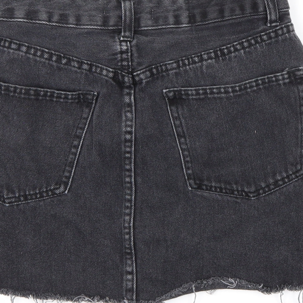 Brand and care label for Bershka women’s grey denim mini skirt, size UK 8