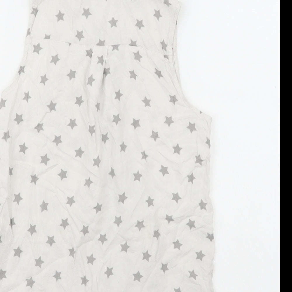 Brand and care label for H&M girls’ white basic button-up, size 12, years