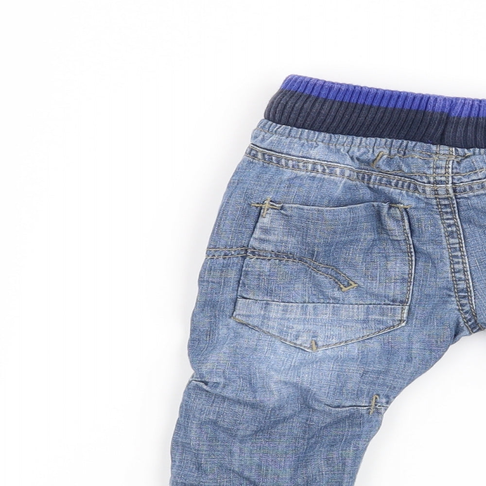Brand and care label for Next boys’ blue cargo jeans, size 3-6, months