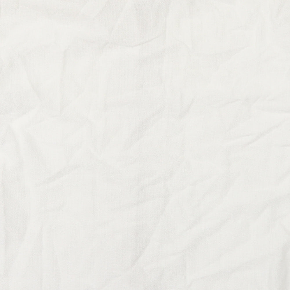 Brand and care label for Adams women’s white basic button-up, size UK 14
