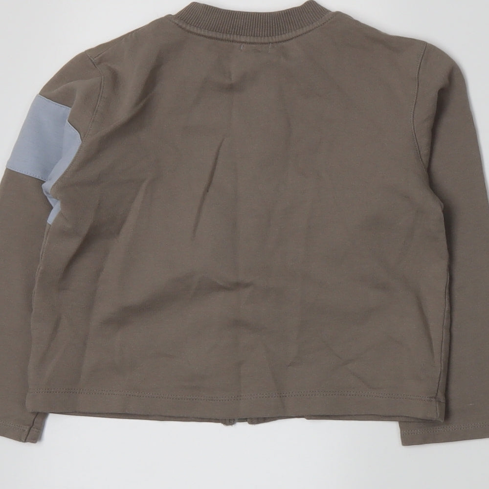 Brand and care label for Petit Boy boys’ brown full zip sweatshirt, size 3, years