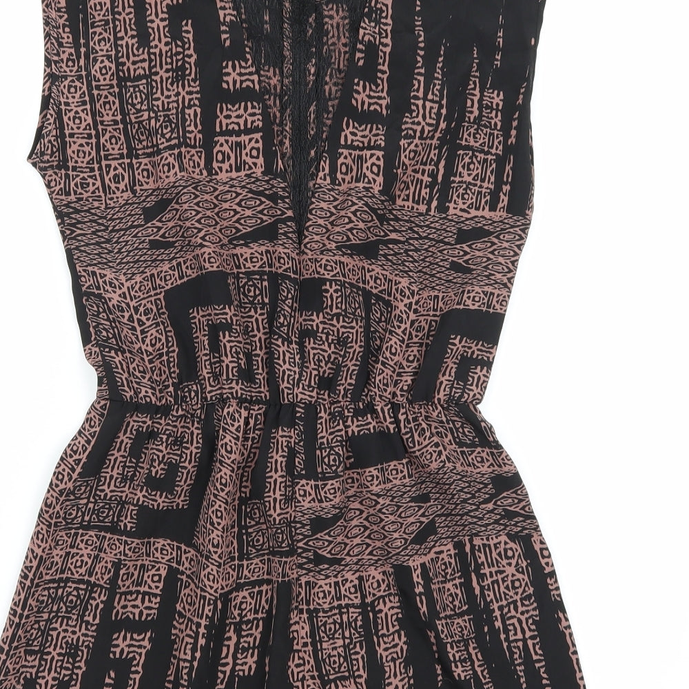 Brand and care label for Sparkle & Fade women’s black playsuit one-piece, size XS