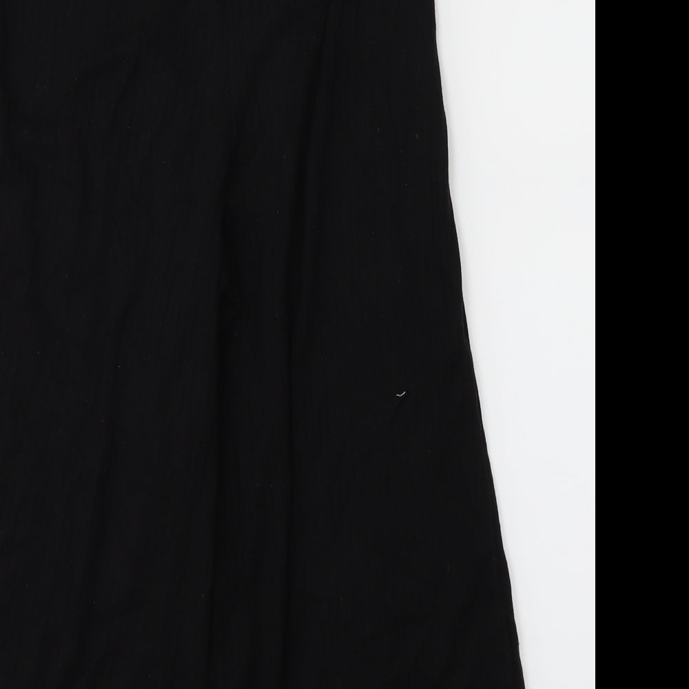 Brand and care label for Missguided women’s black trousers, size UK 6, 20-inch leg