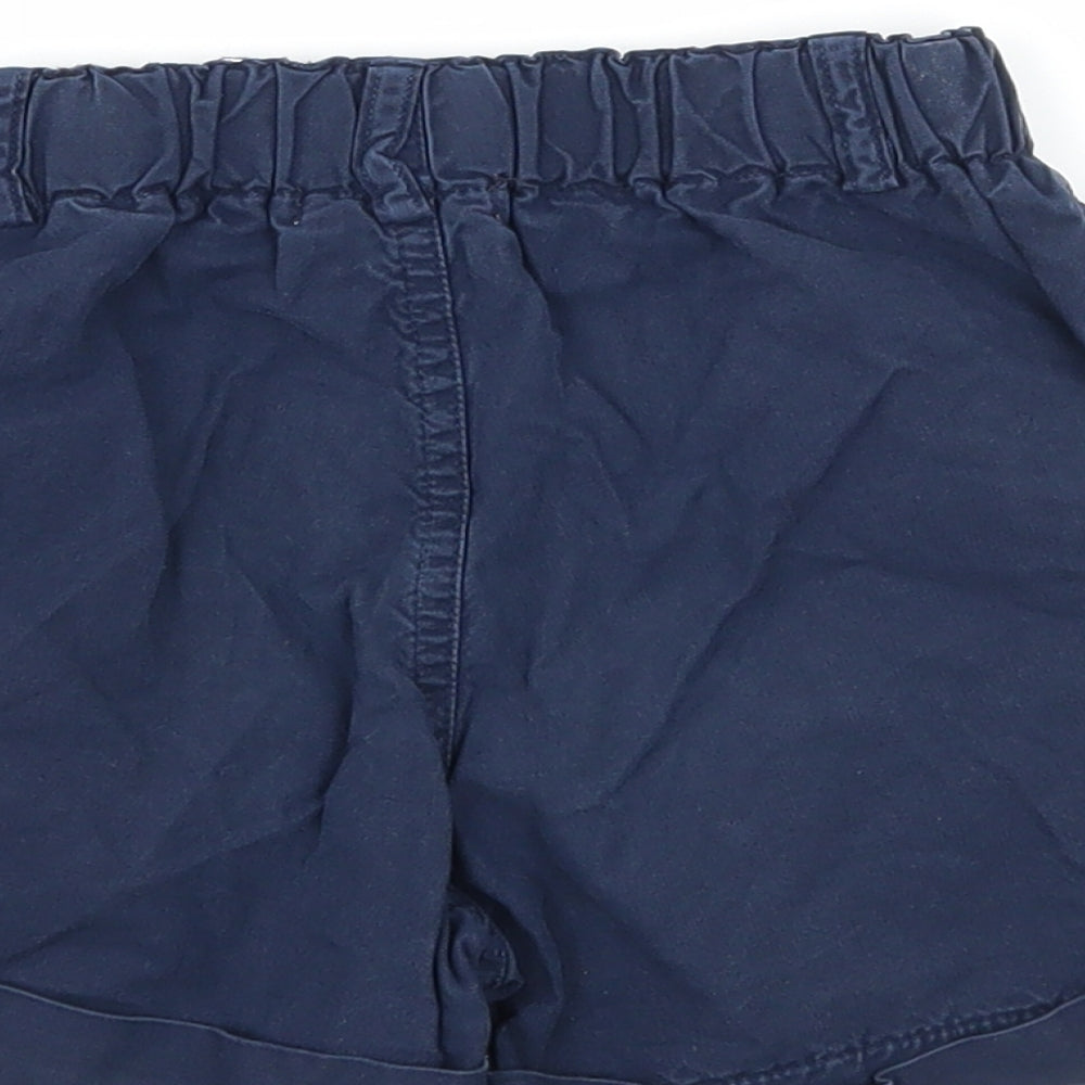 Brand and care label for Perry boys’ blue sweat shorts, size 3-4, years