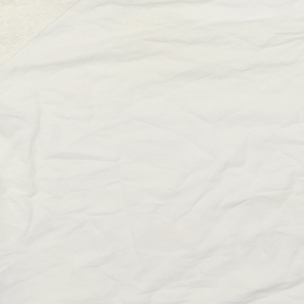 Brand and care label for H&M women’s white jumper, size UK 4