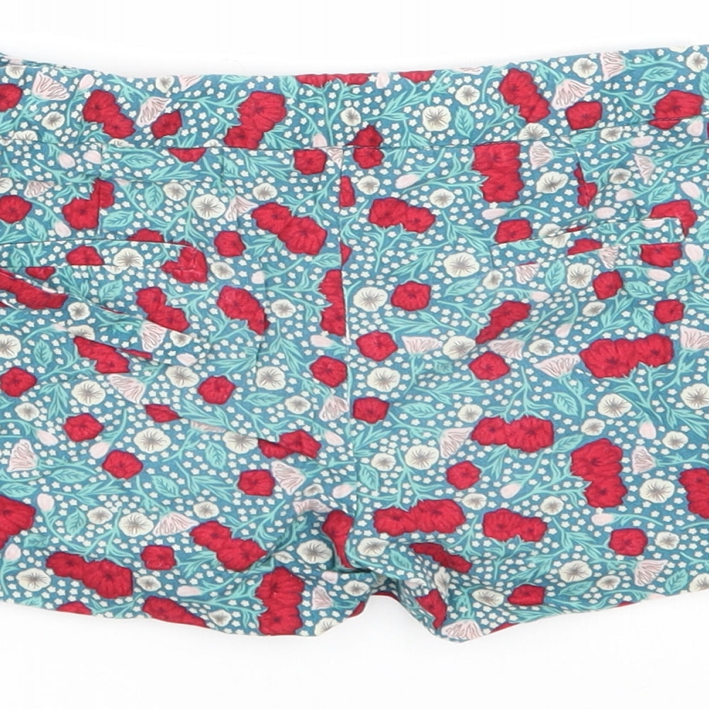 Brand and care label for Palomino girls’ green floral bermuda shorts, size 6, years