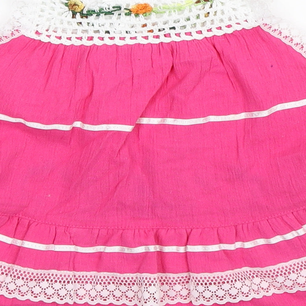 Brand and care label for Preworn girls’ pink fit & flare, size 2, years