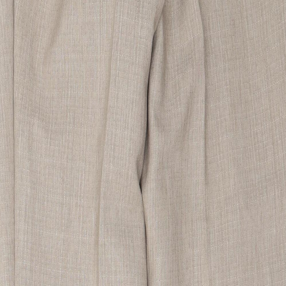Brand and care label for Marks & Spencer women’s beige trousers, size UK 34, in, 27-inch leg