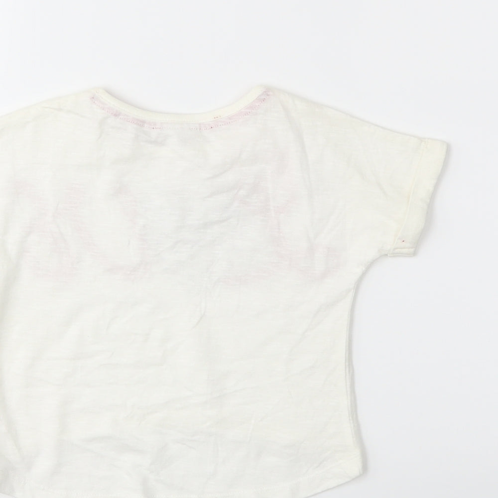 Brand and care label for evie Baby White Basic T-Shirt, size 12, Months