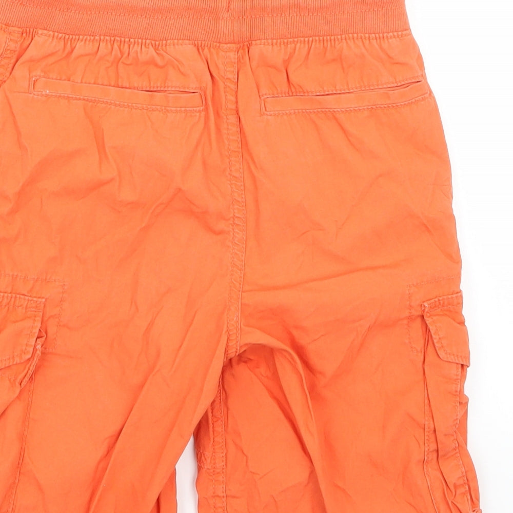 Brand and care label for Gap boys’ orange ramie cargo trousers, size M