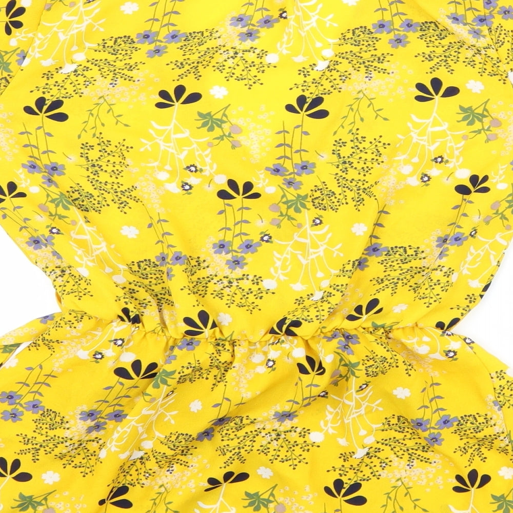 Brand and care label for Sienna Sky women’s yellow floral basic blouse, size XS
