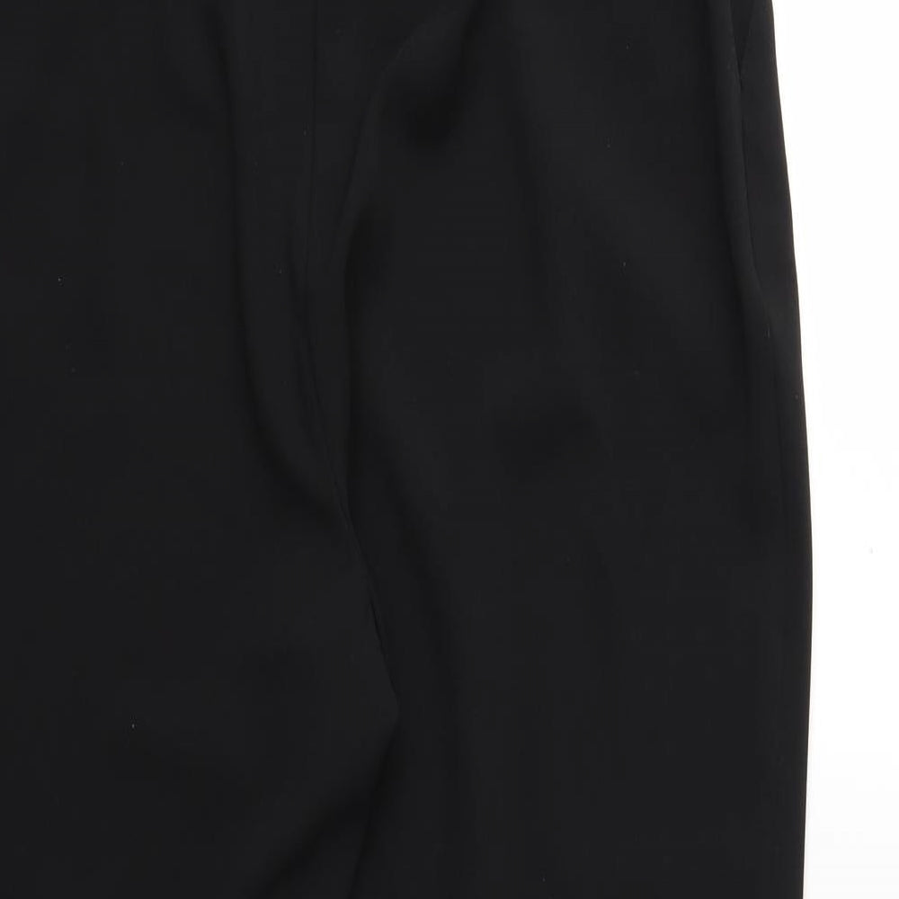 Brand and care label for Marks & Spencer women’s black trousers, size UK 34, in, 27-inch leg