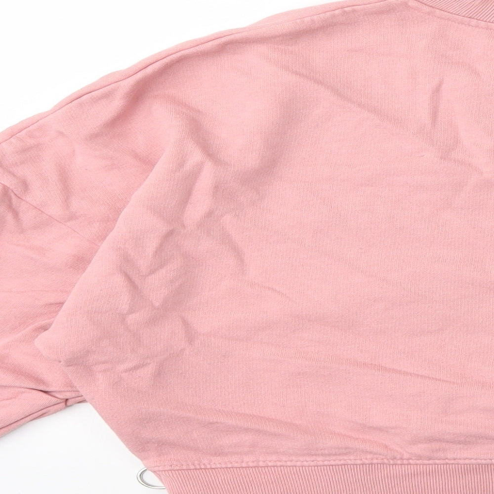 Brand and care label for Lindex women’s pink pullover sweatshirt, size M