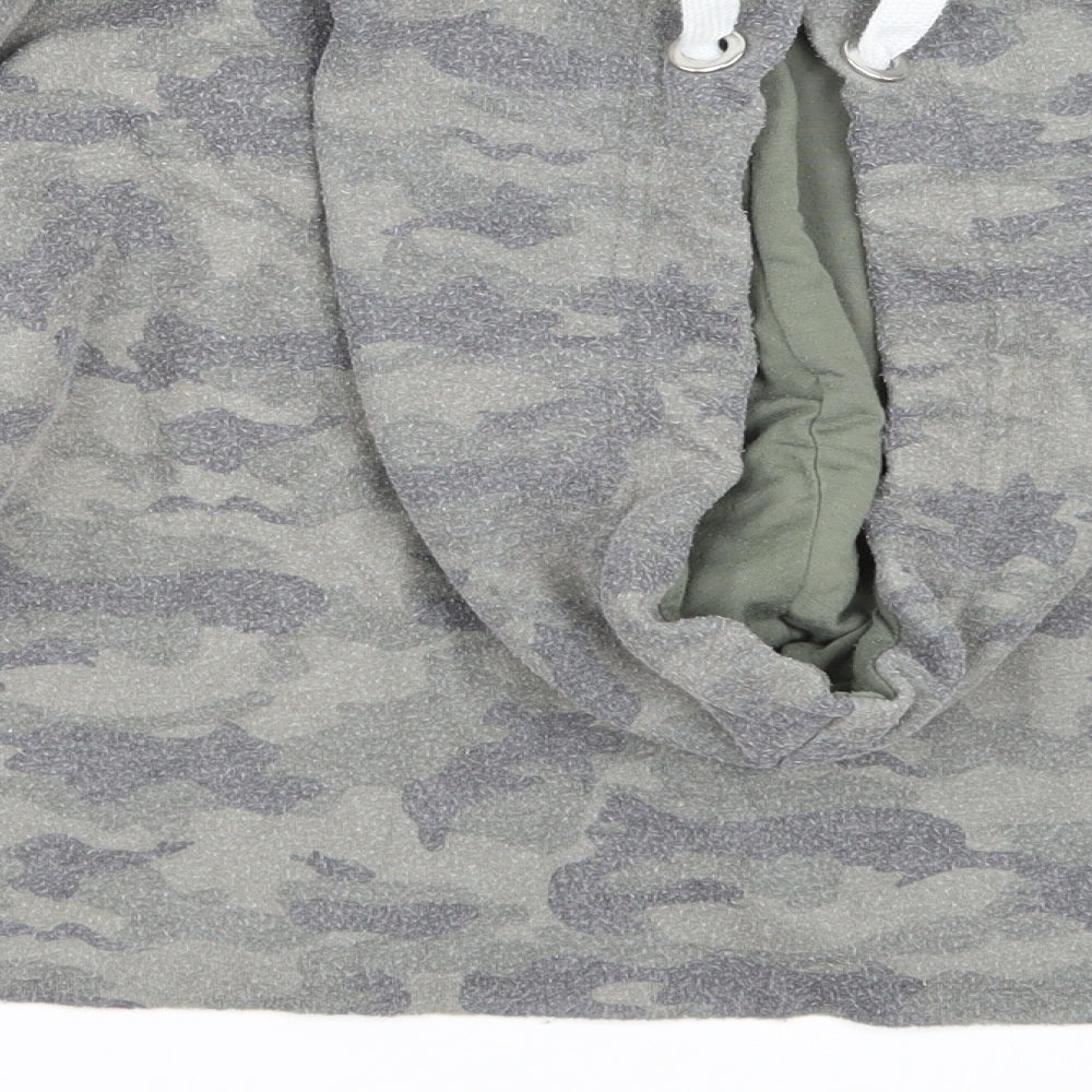 Brand and care label for Primark women’s green camouflage pullover hoodie, size XS
