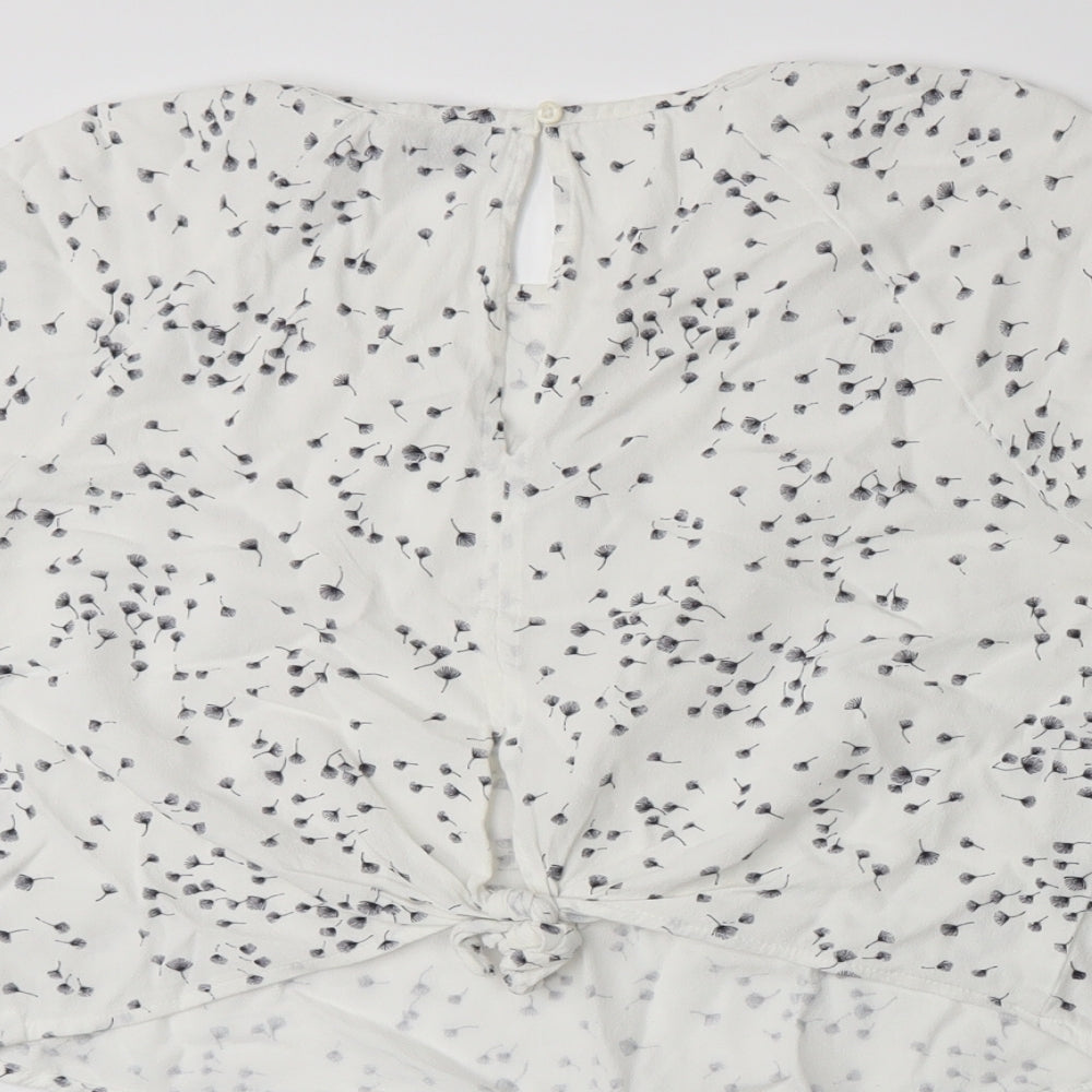 Brand and care label for Bershka women’s white floral basic t-shirt, size L