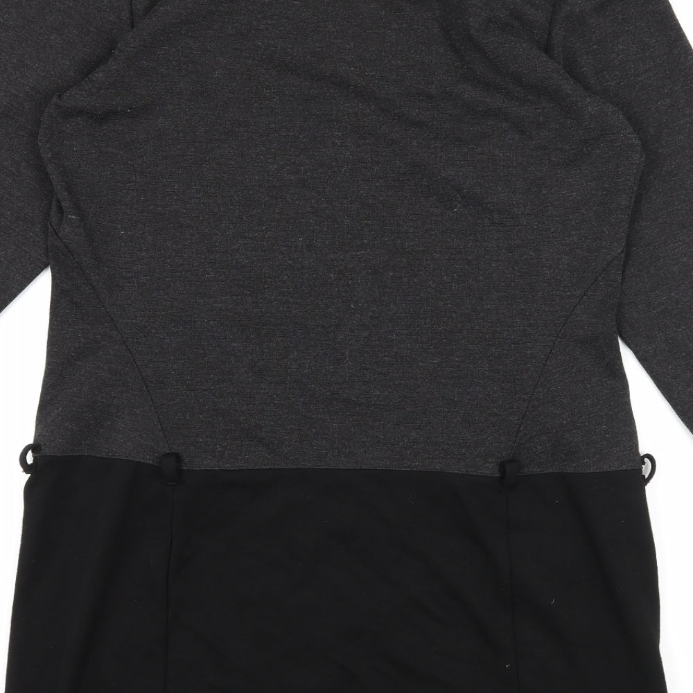Brand and care label for Studio M women’s red jersey a-line, size M