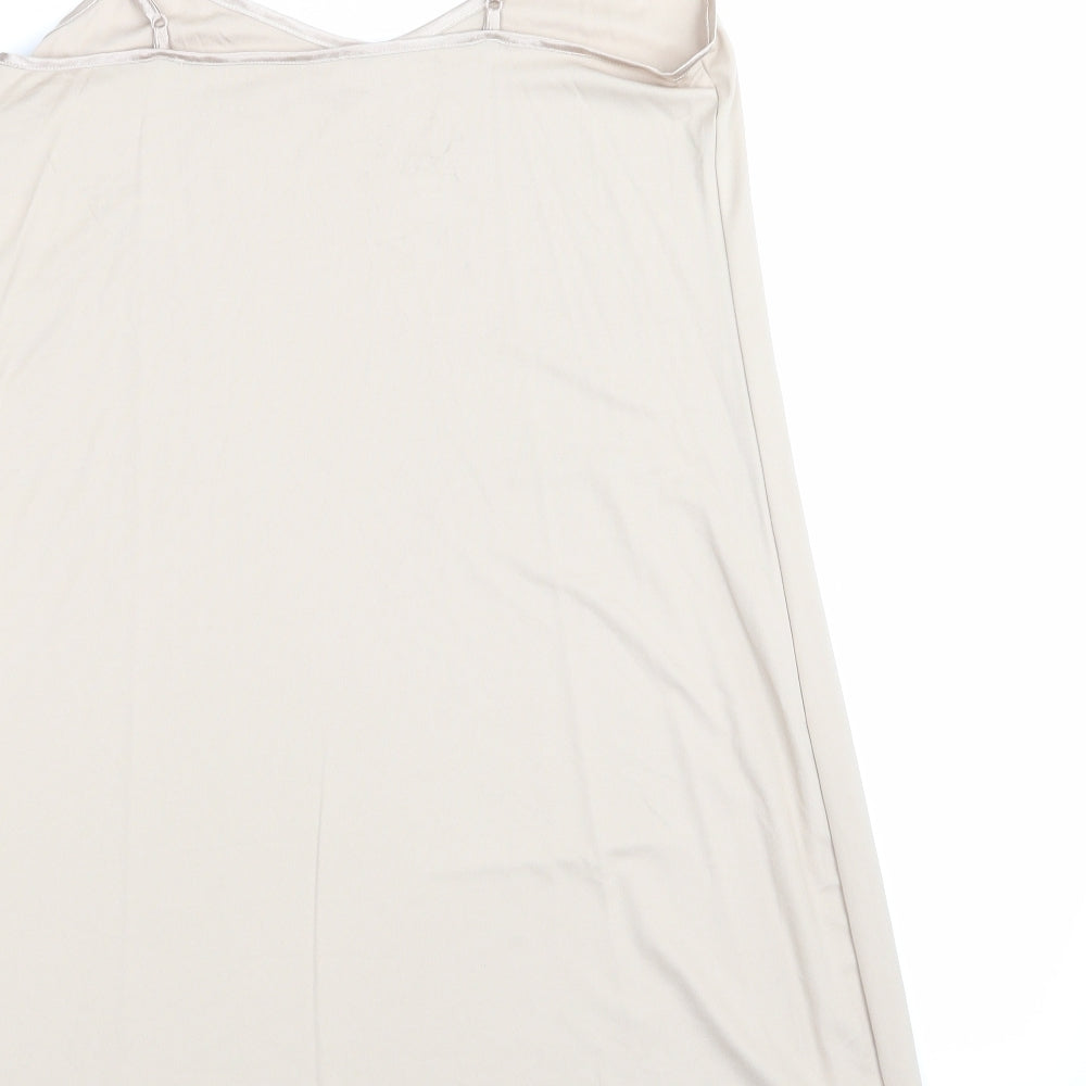 Brand and care label for Marks & Spencer women’s beige solid chemise one piece, size UK 10