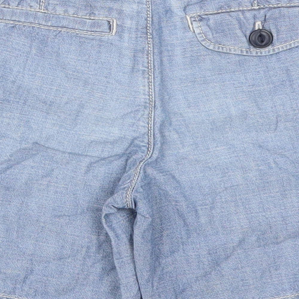 Brand and care label for Gap boys’ blue bermuda shorts, size 4, years