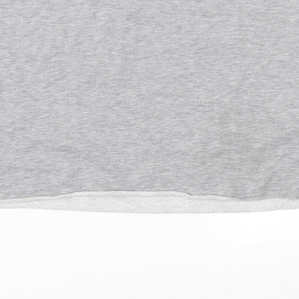 Brand and care label for Candy Couture girls’ grey jersey pullover sweatshirt, size 10, years