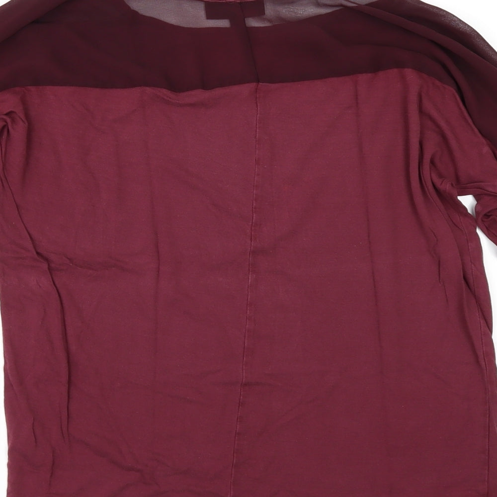 Brand and care label for Warehouse women’s red basic polo, size UK 12