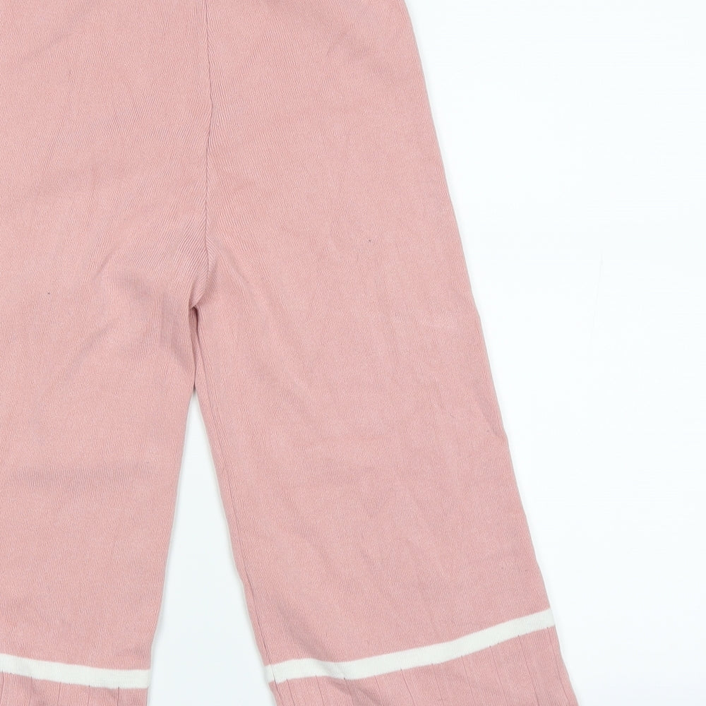 Brand and care label for emily and me girls’ pink sweatpants, size 10, years