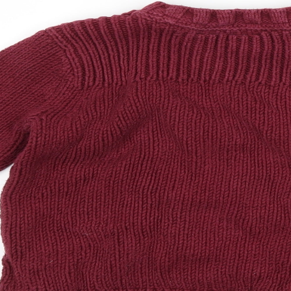 Brand and care label for Gap girls’ purple jumper, size 4-5, years