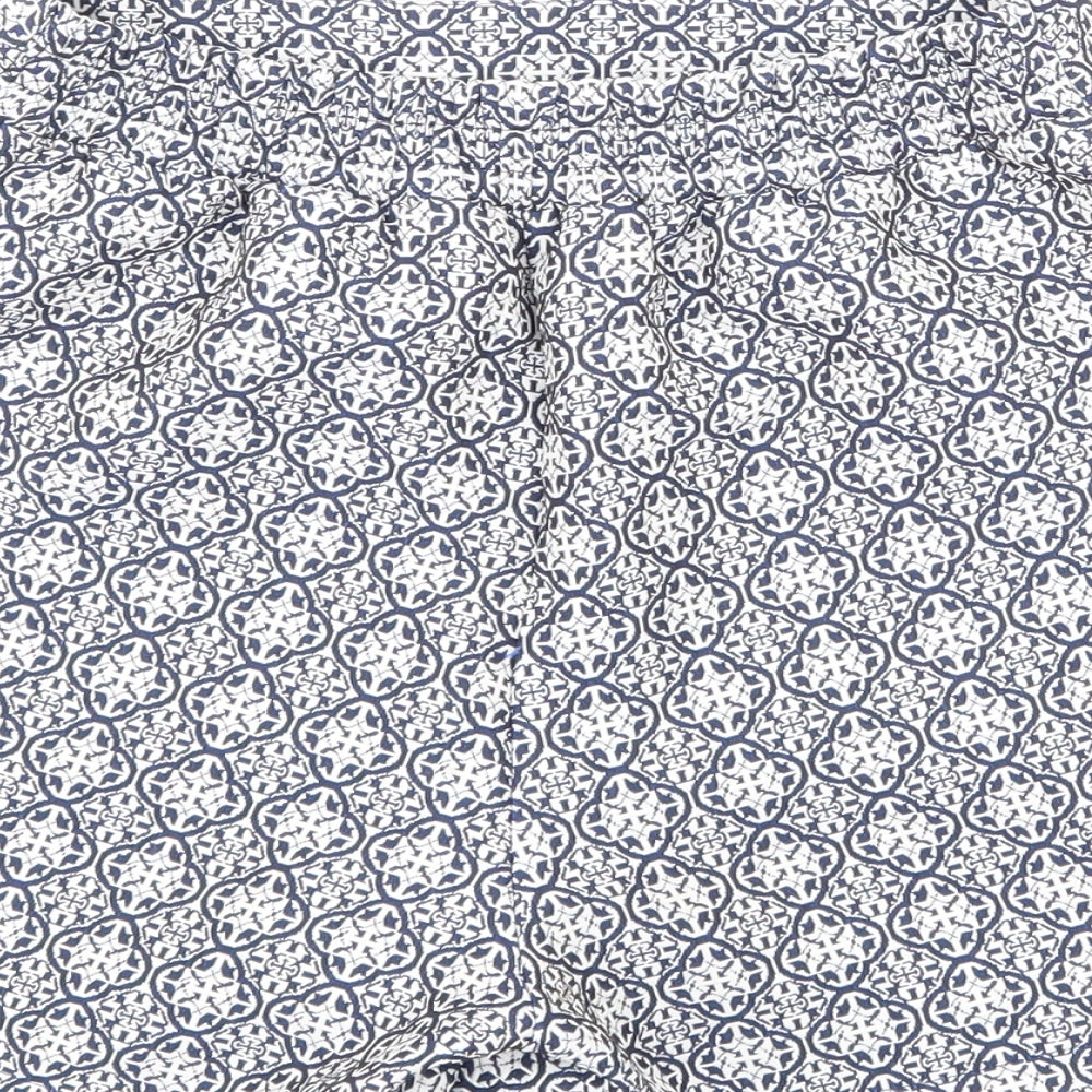 Brand and care label for F&F women’s blue floral hot pants shorts, size UK 23, in
