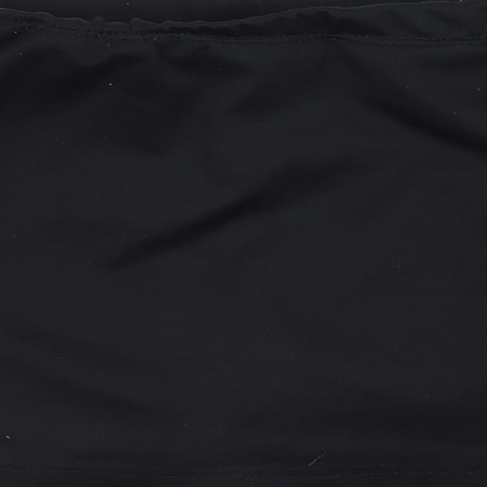 Brand and care label for kookaburra women’s black sweat shorts, size M