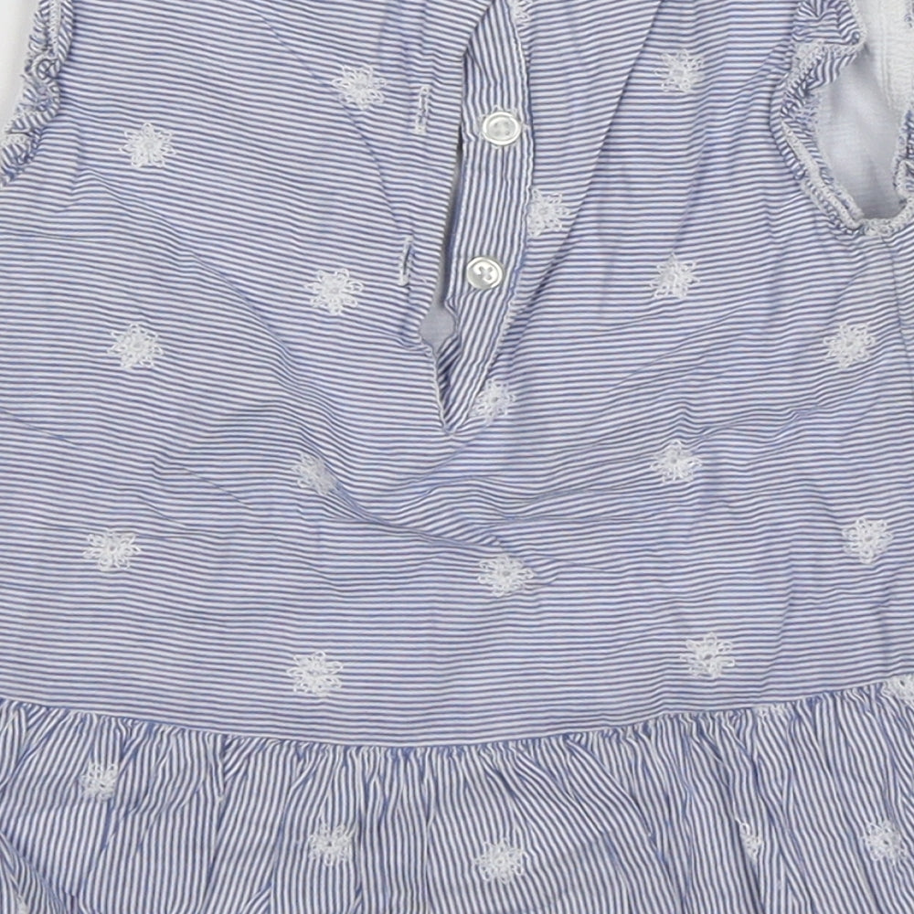 Brand and care label for Tu girls’ blue floral fit & flare, size 12-18, months