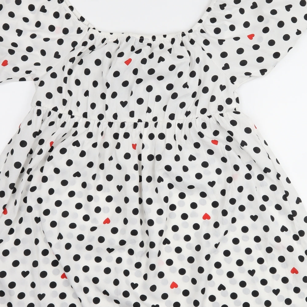 Brand and care label for Wednesday's girl women’s white polka dot shift, size L