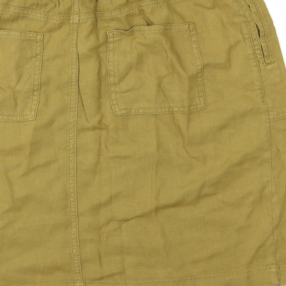 Brand and care label for Marks & Spencer women’s green straight & pencil skirt, size UK 12