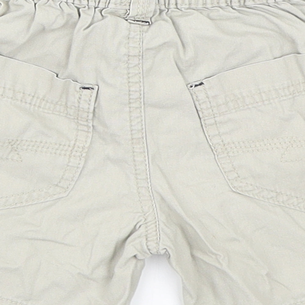 Brand and care label for Next boys’ beige cropped trousers, size 12-18, months