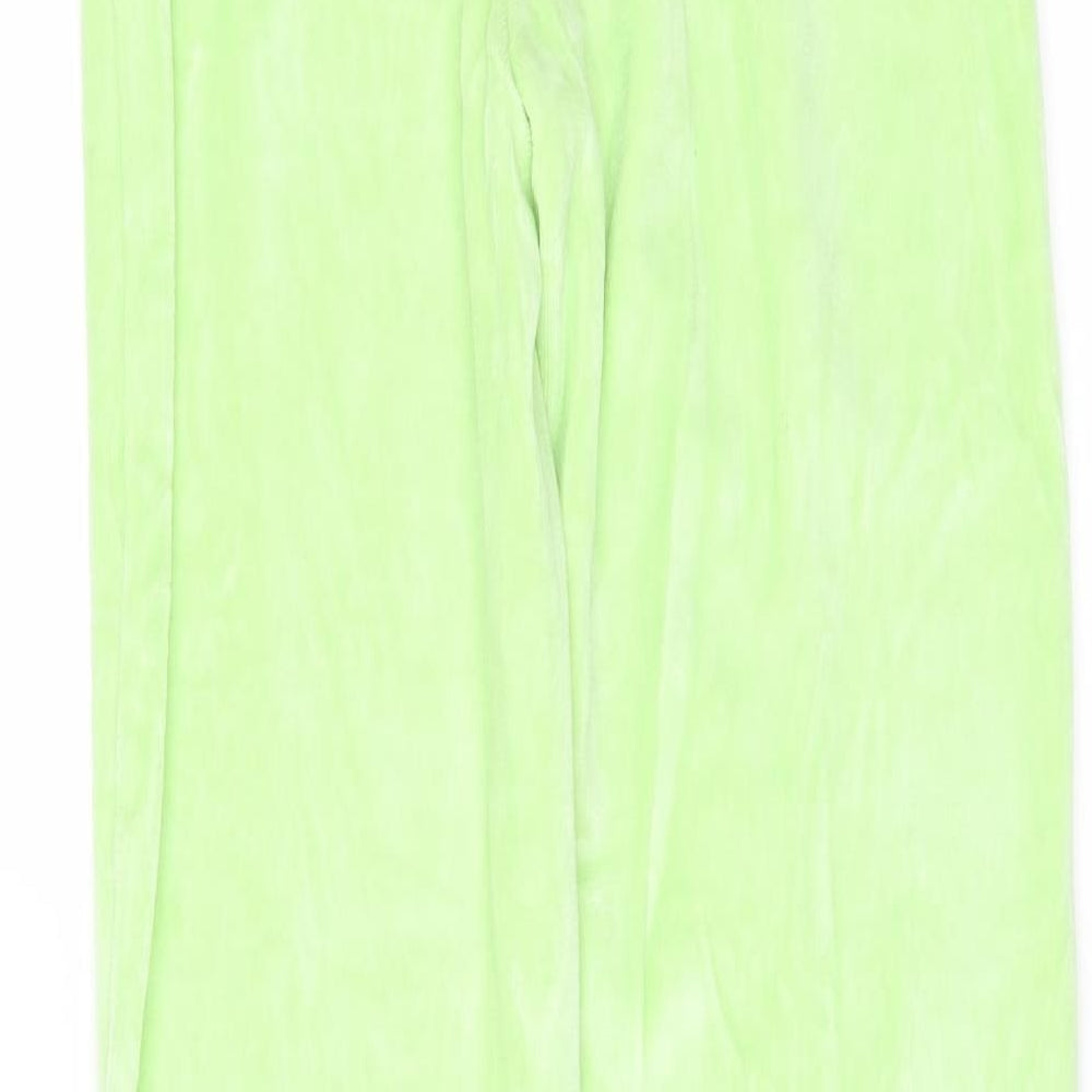Brand and care label for PRETTYLITTLETHING women’s green fleece trousers, size UK 6, 33-inch leg - side splits