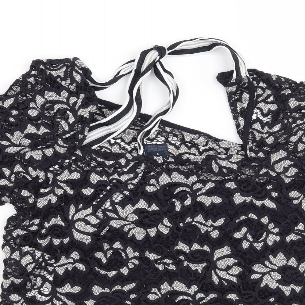 Brand and care label for Preworn women’s blue floral basic blouse, size S