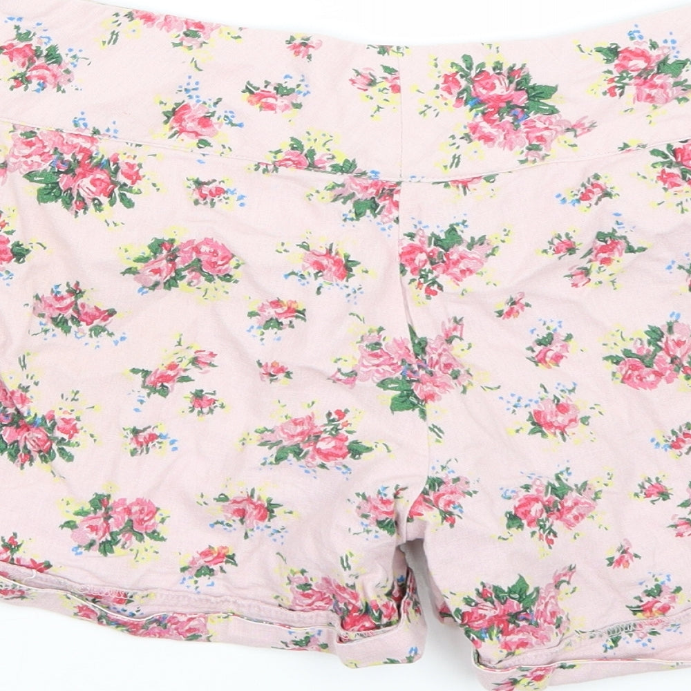 Brand and care label for Darling women’s pink floral bermuda shorts, size S