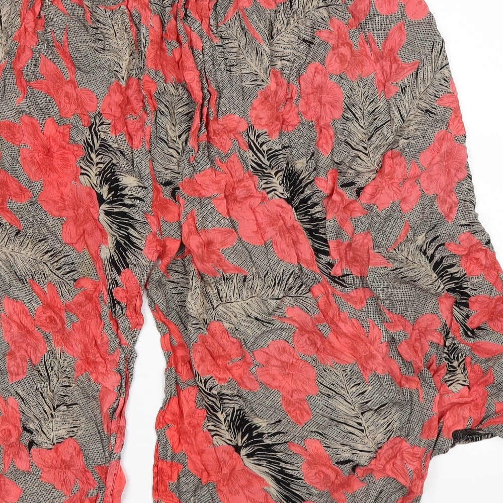 Brand and care label for Topshop women’s pink floral paperbag shorts, size UK 10