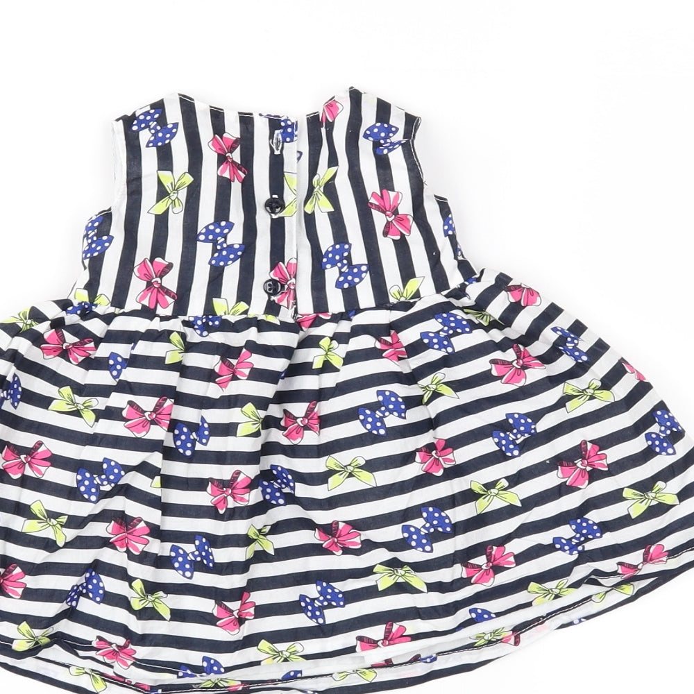 Brand and care label for Early Days girls’ black striped fit & flare, size 3-6, months