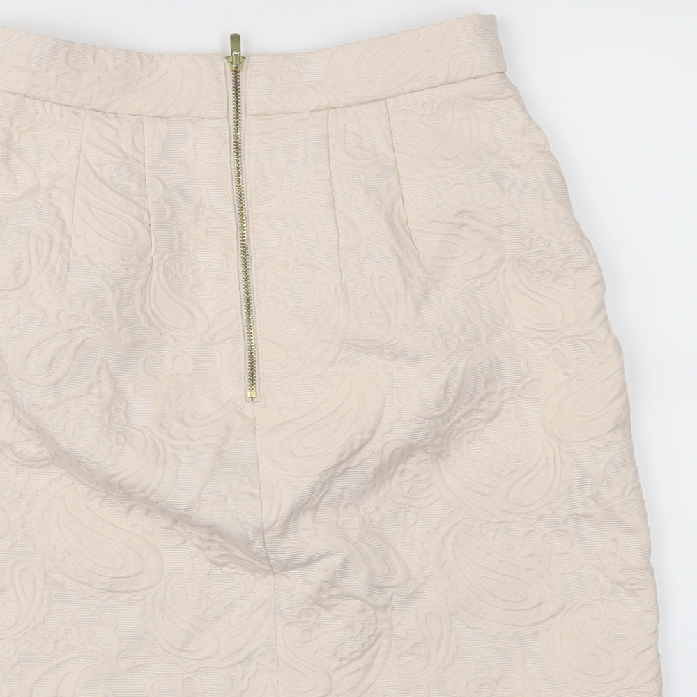Brand and care label for H&M women’s pink paisley a-line skirt, size UK 6