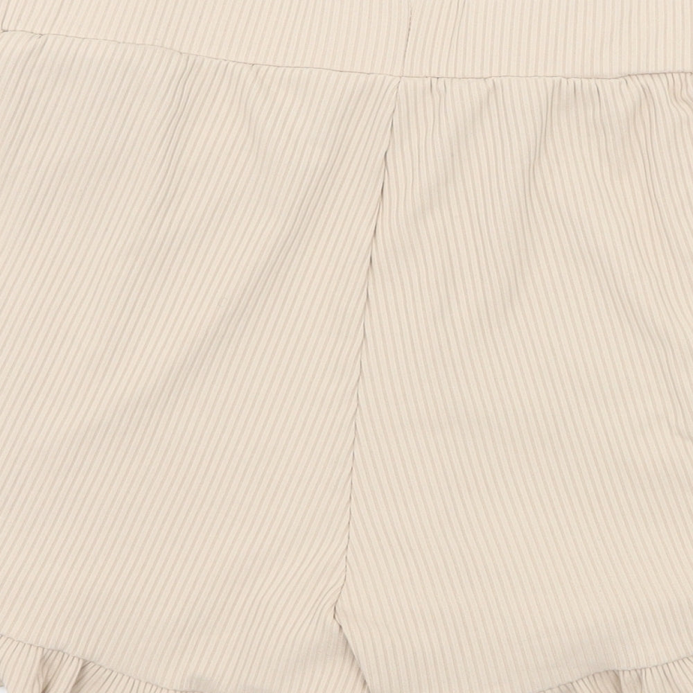 Brand and care label for Preworn women’s beige jersey sweat shorts, size L
