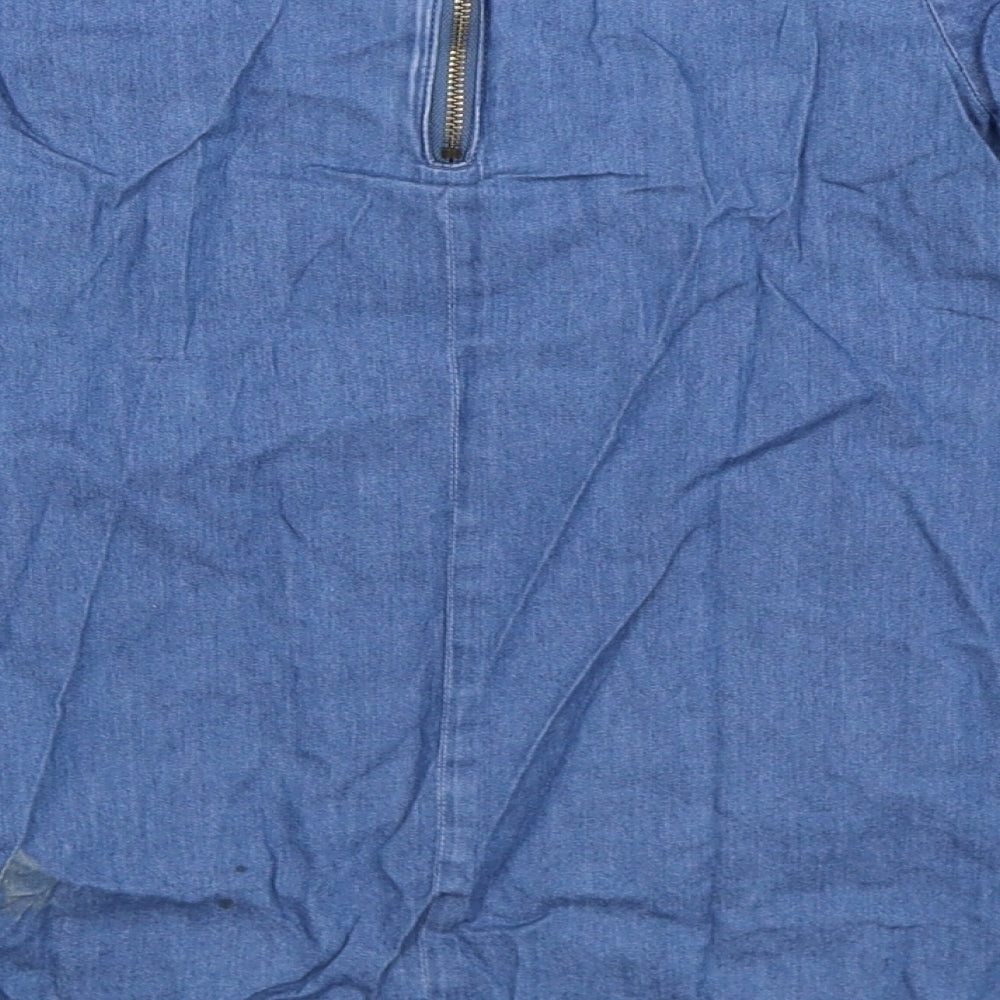 Brand and care label for Lindex girls’ blue denim shirt dress, size S