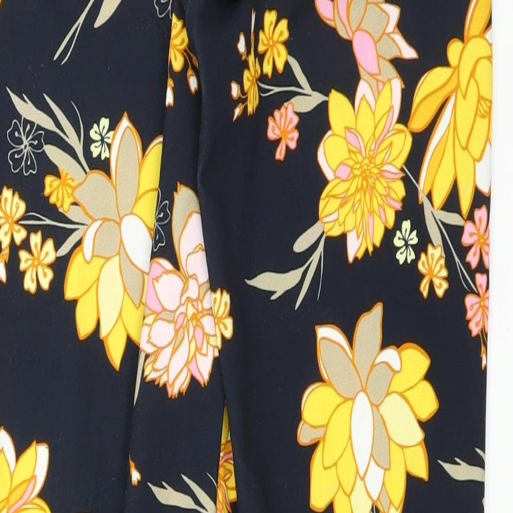 Brand and care label for Betty Barclay women’s blue floral trousers, size UK 8, 30-inch leg