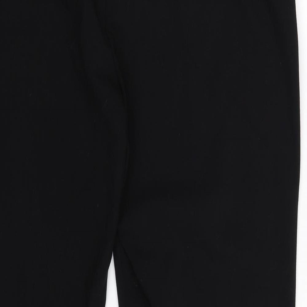 Brand and care label for Marks & Spencer women’s blue trousers, size UK 14, 29-inch leg