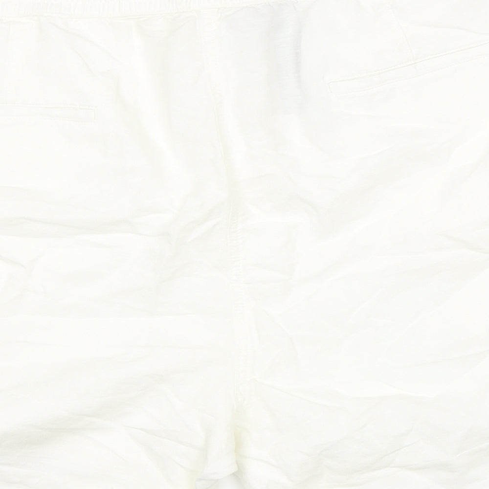 Brand and care label for Marks & Spencer women’s white cargo shorts, size UK 22, in