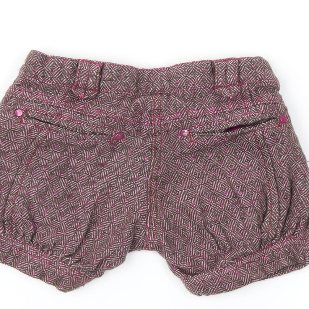Brand and care label for tuc tuc girls’ purple cut-off shorts, size 2, years