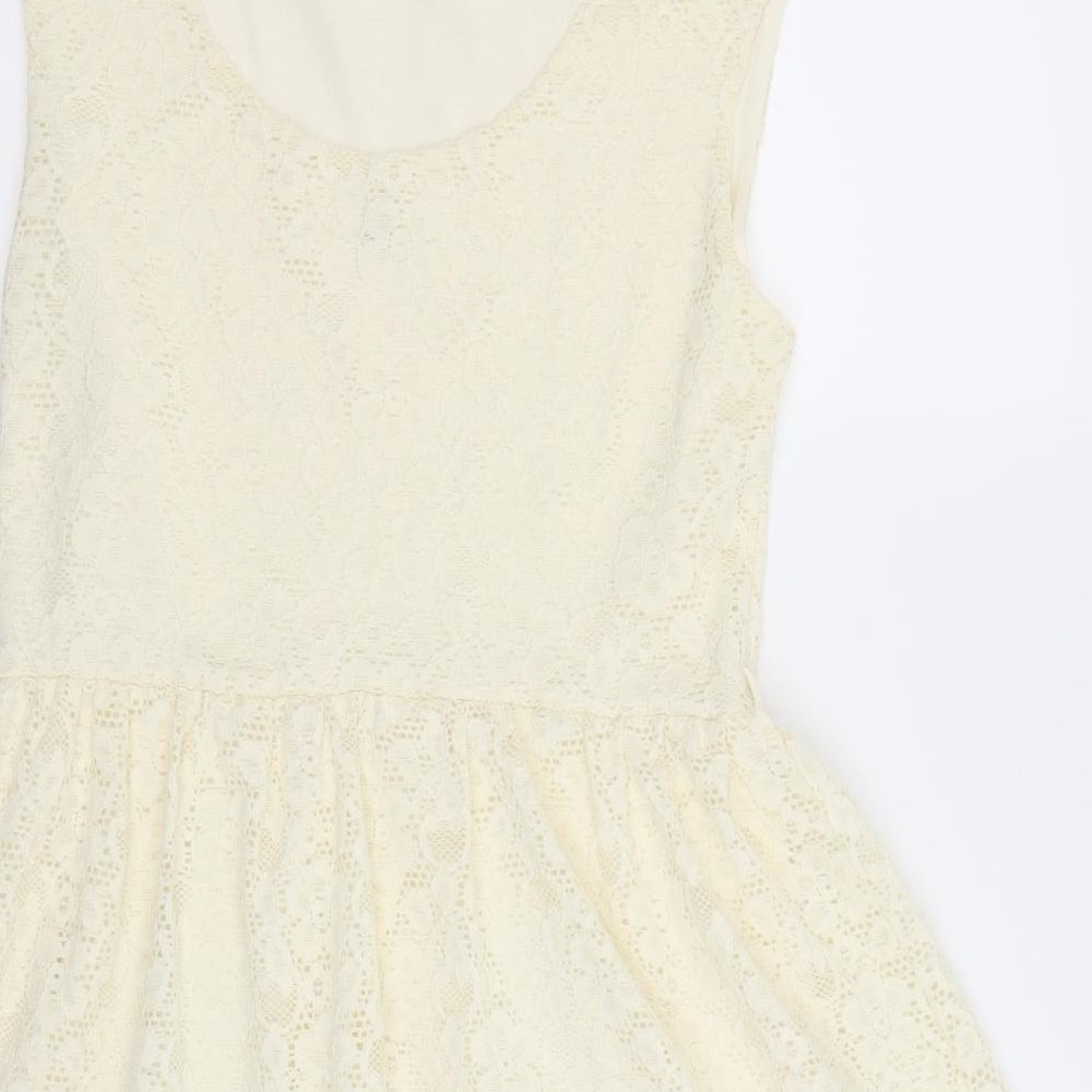 Brand and care label for River Island women’s ivory geometric fit & flare, size UK 12