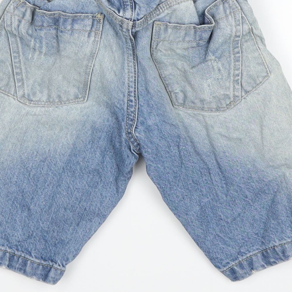 Brand and care label for Preworn boys’ blue cargo shorts, size 8, years