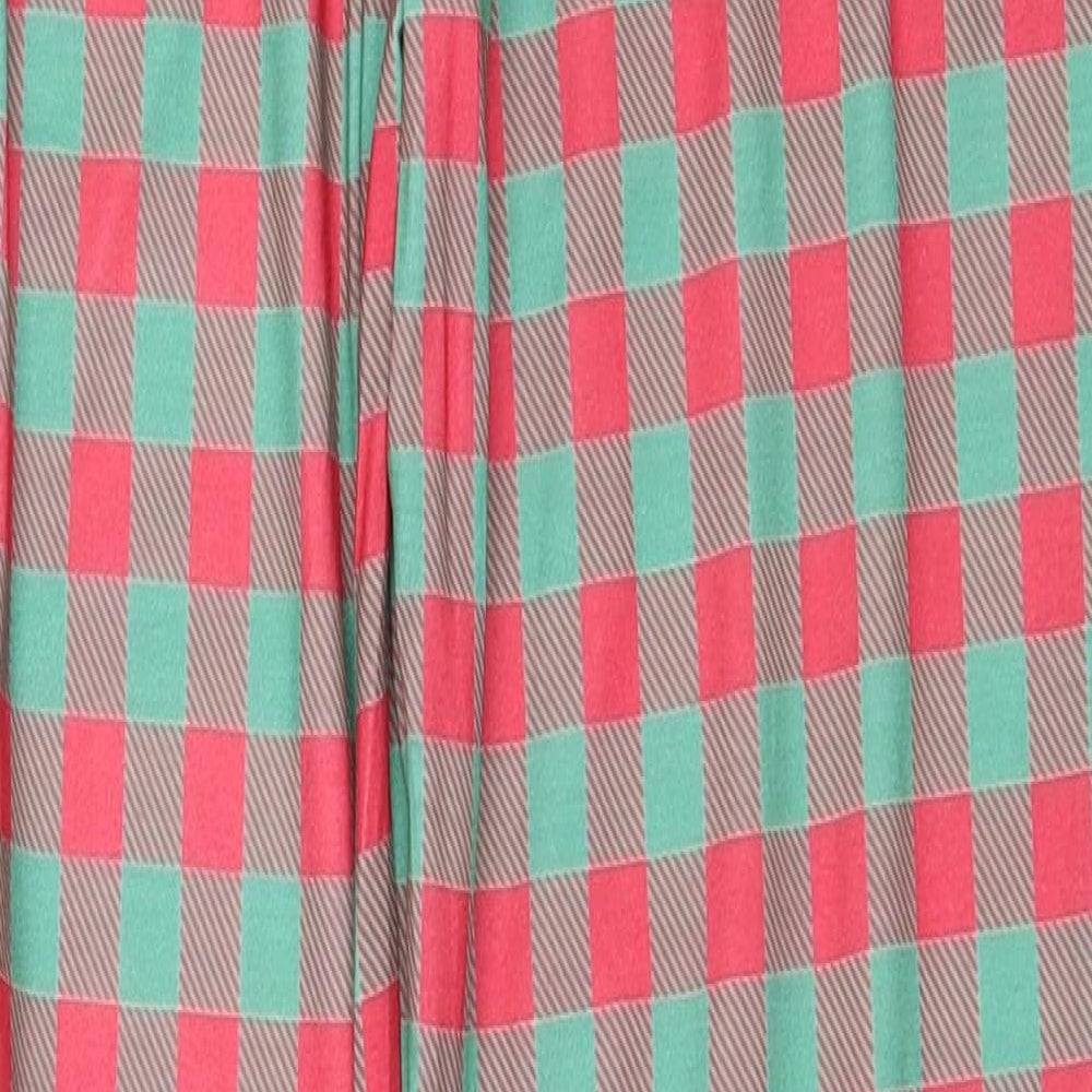 Brand and care label for In the Style women’s red trousers, size S, 28-inch leg