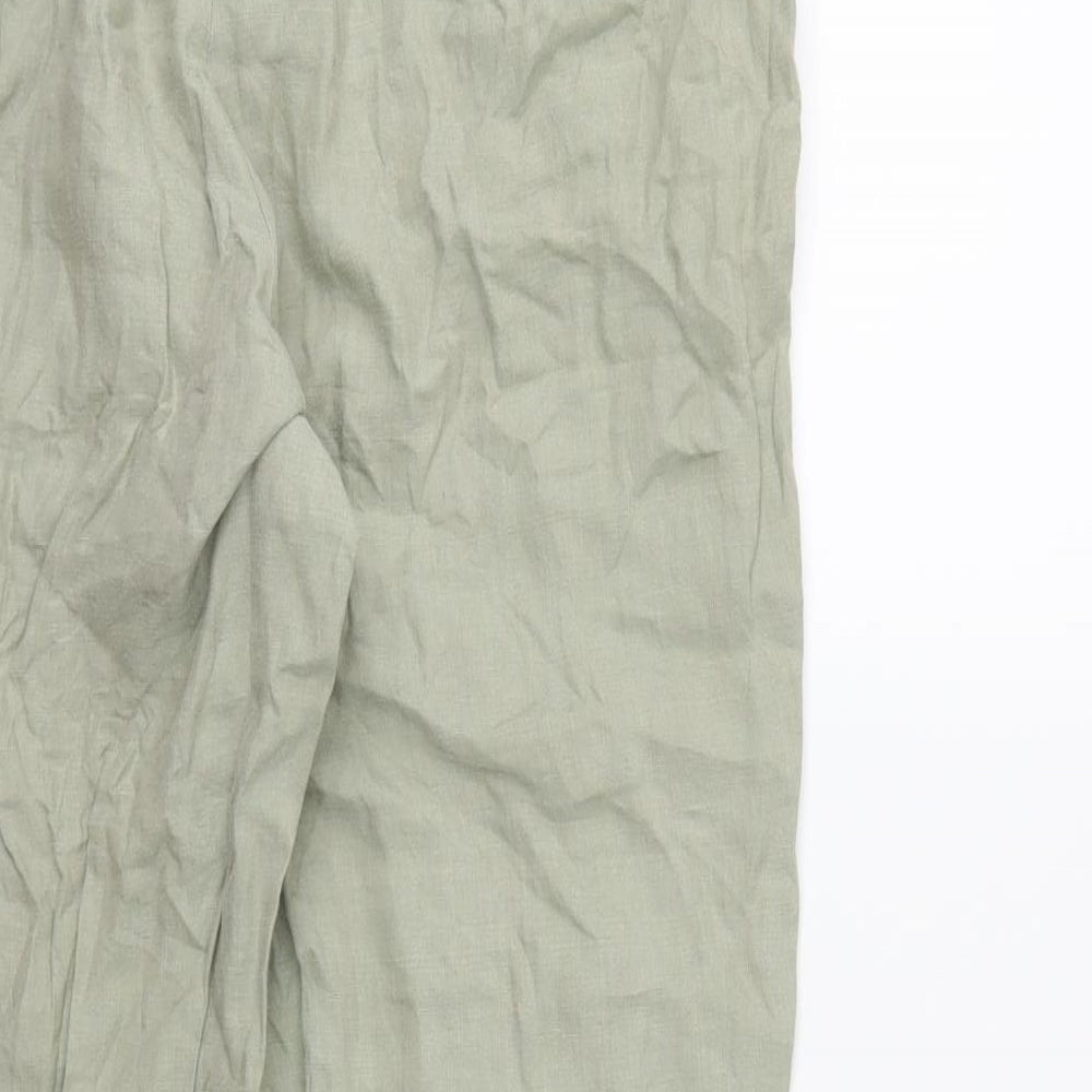 Brand and care label for Preworn women’s green trousers, size UK 34, in, 27-inch leg