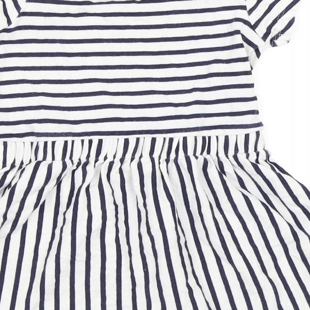 Brand and care label for George girls’ white striped skater dress, size 12-18, months
